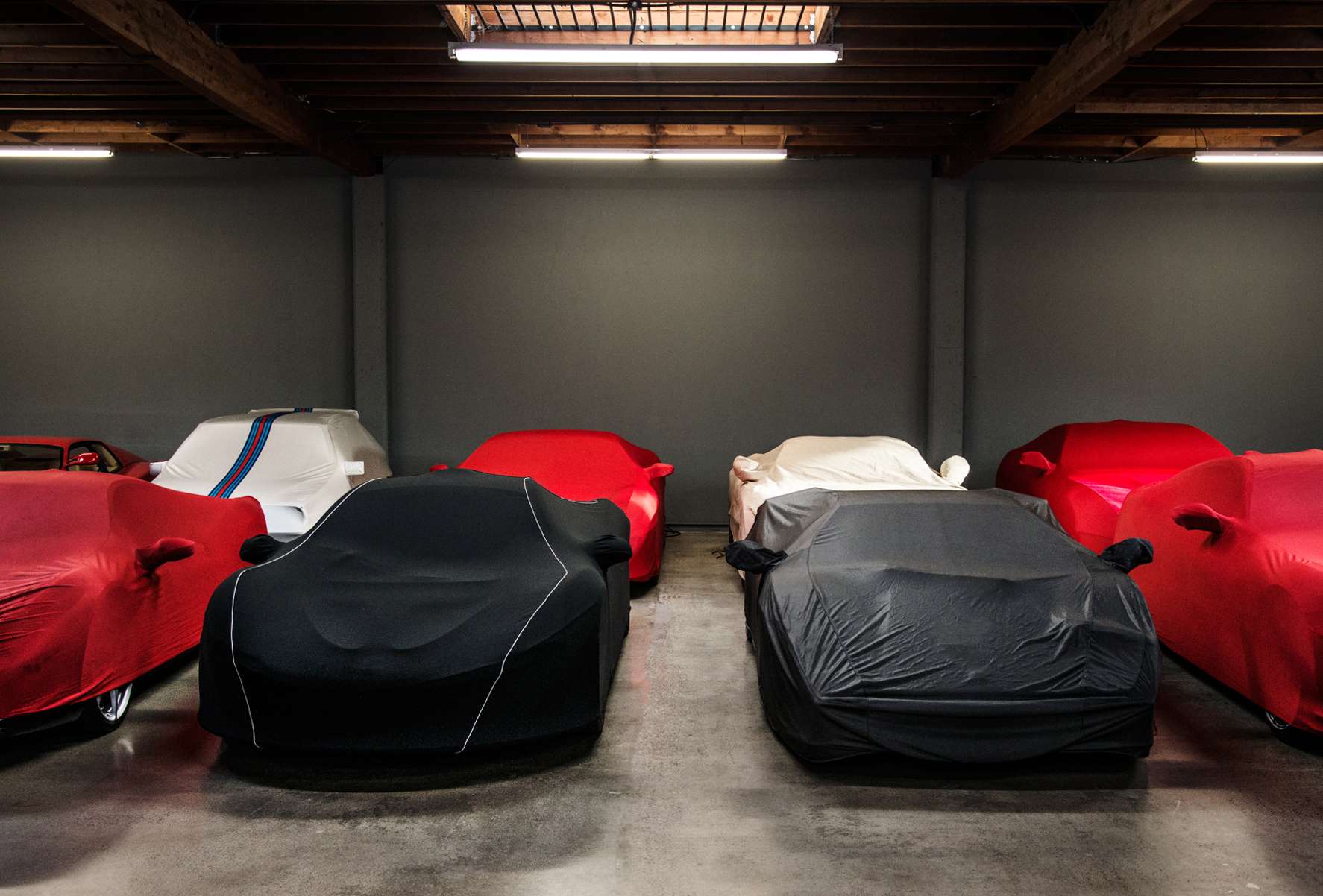 multile cars with covers in garage